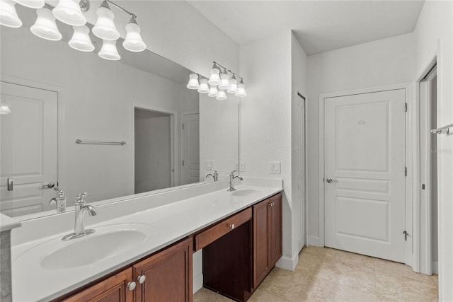 8362 Bella Tierra Ct Unit 10146, Davenport, FL 33896 - bathroom featuring double vanity, tile patterned floors, and a chandelier