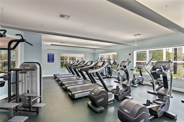8362 Bella Tierra Ct Unit 10146, Davenport, FL 33896 - exercise room featuring baseboards