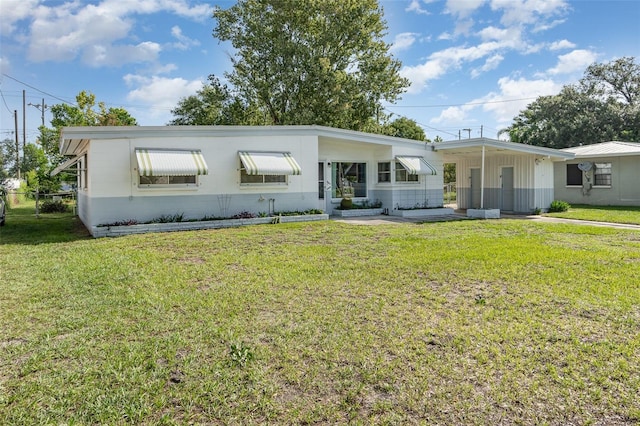 5617 Kalmia Dr, Orlando, FL 32807 - view of front of home with a carport, board and batten siding, and driveway