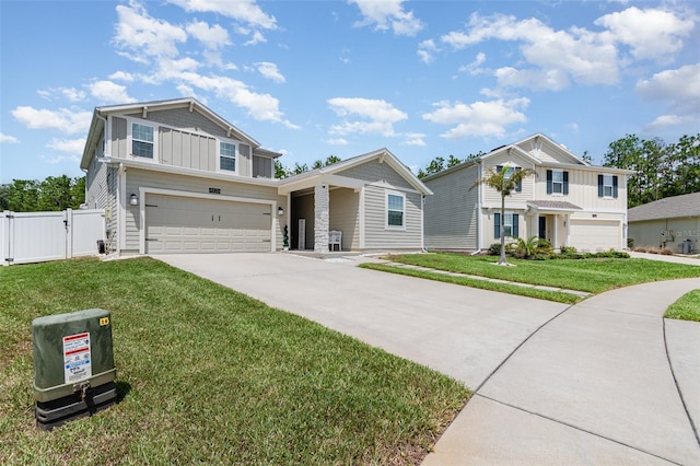 4828 Magnetite Loop, Mount Dora, FL 32757 - view of front facade with board and batten siding, driveway, an attached garage, and a gate
