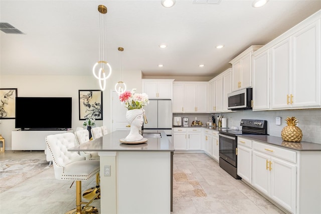 4828 Magnetite Loop, Mount Dora, FL 32757 - kitchen featuring electric range, freestanding refrigerator, recessed lighting, and white cabinets