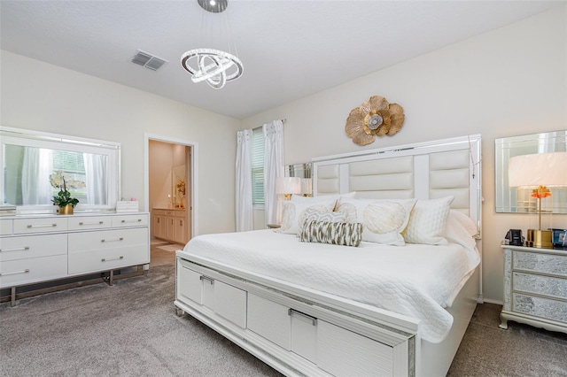 4828 Magnetite Loop, Mount Dora, FL 32757 - bedroom featuring dark colored carpet, a chandelier, and ensuite bathroom