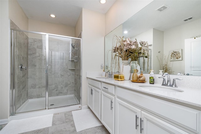 4828 Magnetite Loop, Mount Dora, FL 32757 - bathroom featuring double vanity, a stall shower, and recessed lighting