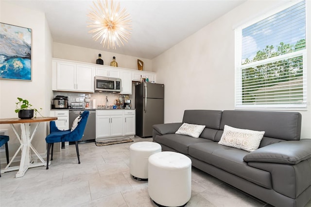 4828 Magnetite Loop, Mount Dora, FL 32757 - living room with a chandelier