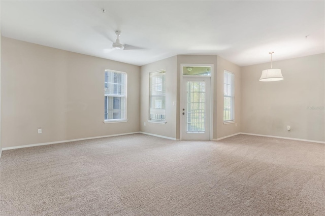 408 Summit Ridge Pl Unit 210, Longwood, FL 32779 - spare room featuring a ceiling fan and light carpet