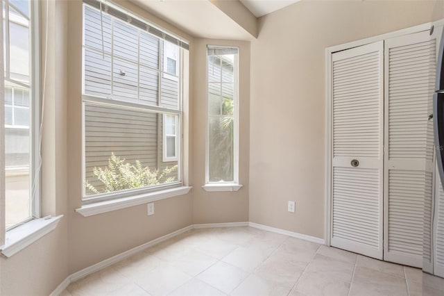 408 Summit Ridge Pl Unit 210, Longwood, FL 32779 - unfurnished bedroom featuring a closet and light tile patterned floors