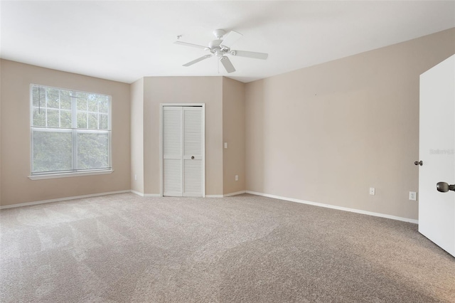 408 Summit Ridge Pl Unit 210, Longwood, FL 32779 - unfurnished bedroom with carpet, a closet, and a ceiling fan