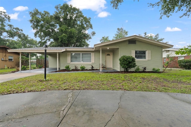 575 Ave M SE, Winter Haven, FL 33880 - ranch-style home featuring concrete driveway and an attached carport
