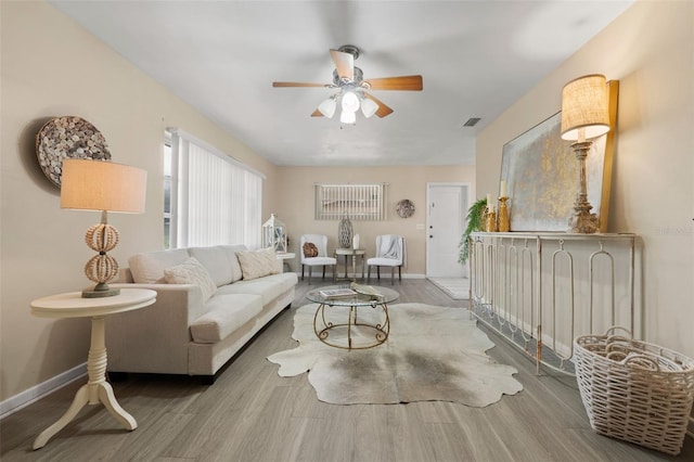 575 Ave M SE, Winter Haven, FL 33880 - living room with ceiling fan and wood finished floors