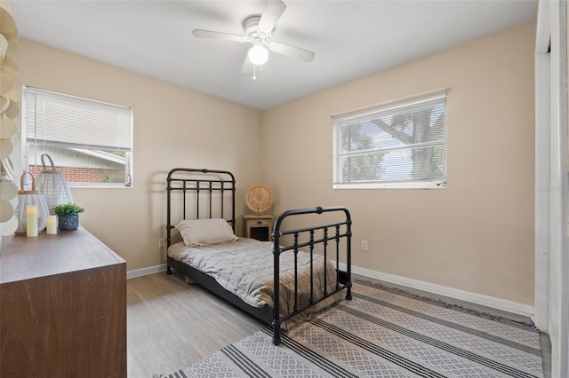 575 Ave M SE, Winter Haven, FL 33880 - bedroom featuring light wood-style flooring and a ceiling fan