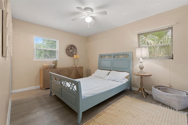 575 Ave M SE, Winter Haven, FL 33880 - bedroom featuring wood finished floors and a ceiling fan