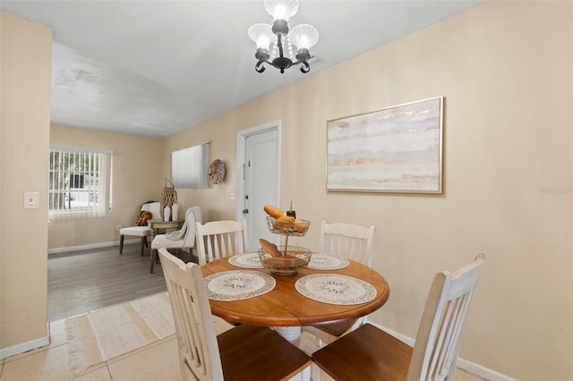 575 Ave M SE, Winter Haven, FL 33880 - dining space featuring baseboards and a chandelier