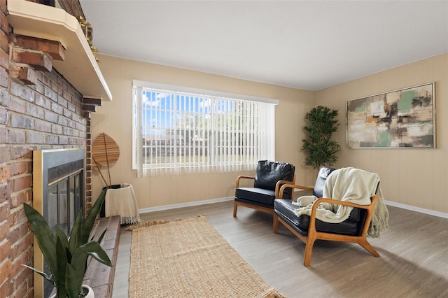 575 Ave M SE, Winter Haven, FL 33880 - sitting room with wood finished floors and a fireplace