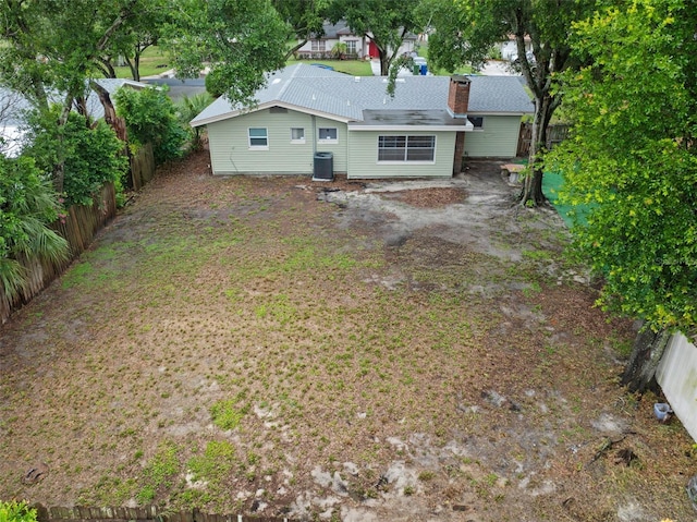 575 Ave M SE, Winter Haven, FL 33880 - rear view of property with a fenced backyard and a chimney