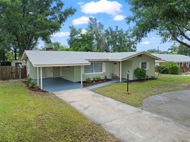 575 Ave M SE, Winter Haven, FL 33880 - single story home featuring concrete driveway, an attached carport, and a shingled roof