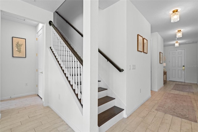 17571 Saw Palmeto Ave, Clermont, FL 34714 - stairs with wood finished floors and baseboards