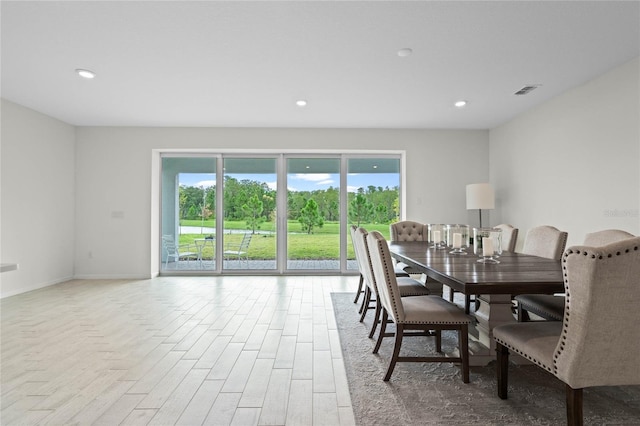 17571 Saw Palmeto Ave, Clermont, FL 34714 - dining area featuring plenty of natural light, wood finished floors, and recessed lighting