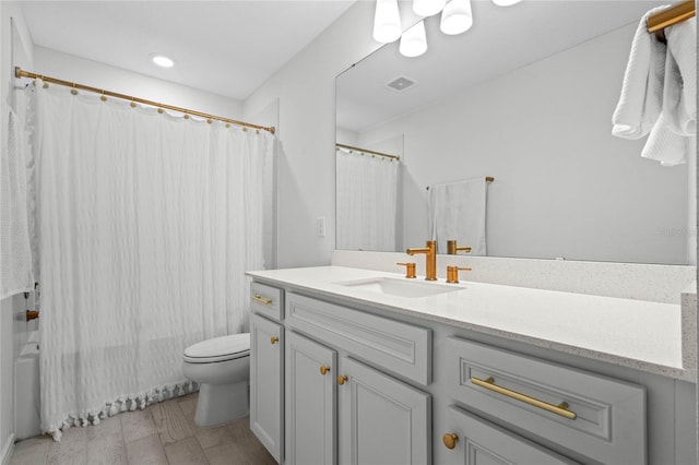 17571 Saw Palmeto Ave, Clermont, FL 34714 - bathroom with vanity, shower / bath combo with shower curtain, wood finished floors, and recessed lighting