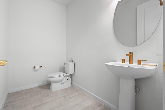 17571 Saw Palmeto Ave, Clermont, FL 34714 - half bath featuring wood finished floors and toilet