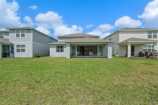 17571 Saw Palmeto Ave, Clermont, FL 34714 - back of house with a yard, a sunroom, stucco siding, and a shingled roof
