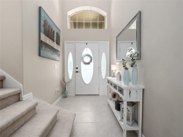 2454 Black Lake Blvd, Winter Garden, FL 34787 - entrance foyer featuring stairway, light tile patterned floors, and a high ceiling