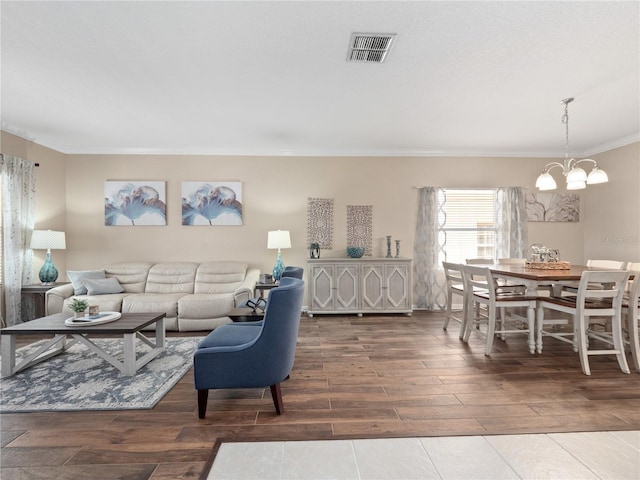 2454 Black Lake Blvd, Winter Garden, FL 34787 - living room with crown molding, a chandelier, and wood finished floors