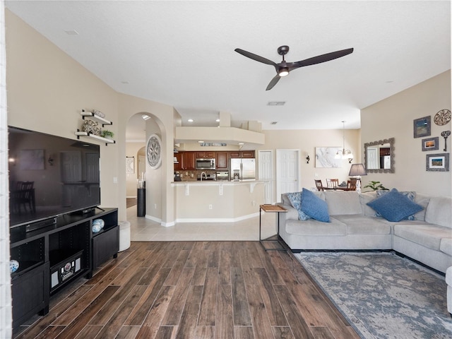 2454 Black Lake Blvd, Winter Garden, FL 34787 - living room with a ceiling fan, wood finished floors, and arched walkways