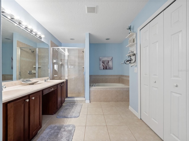 2454 Black Lake Blvd, Winter Garden, FL 34787 - full bath with a closet, tile patterned flooring, a bath, a stall shower, and double vanity