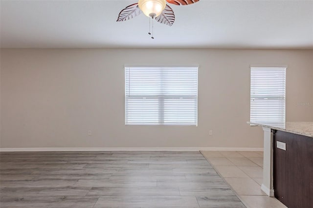 12104 Fawn Brindle St, Riverview, FL 33578 - unfurnished dining area with a ceiling fan and baseboards
