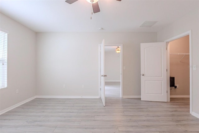 12104 Fawn Brindle St, Riverview, FL 33578 - empty room featuring a ceiling fan, light wood finished floors, and healthy amount of natural light