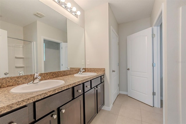 12104 Fawn Brindle St, Riverview, FL 33578 - bathroom with tile patterned floors, double vanity, and a shower