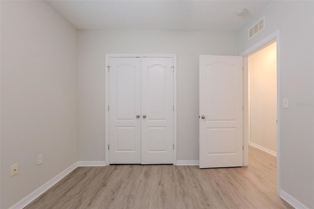 12104 Fawn Brindle St, Riverview, FL 33578 - unfurnished bedroom featuring light wood finished floors and a closet