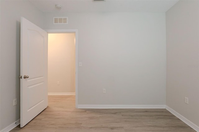 12104 Fawn Brindle St, Riverview, FL 33578 - spare room with light wood finished floors and a smoke detector