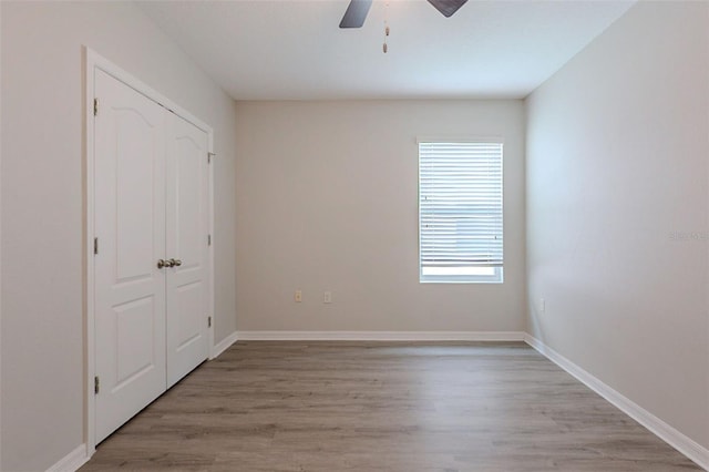 12104 Fawn Brindle St, Riverview, FL 33578 - unfurnished bedroom featuring light wood-style floors, a closet, and ceiling fan