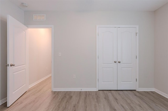 12104 Fawn Brindle St, Riverview, FL 33578 - unfurnished bedroom with light wood-style floors and a closet
