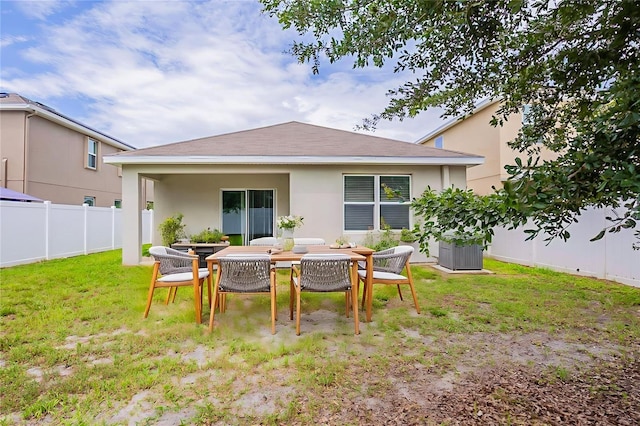 12104 Fawn Brindle St, Riverview, FL 33578 - rear view of property featuring stucco siding and outdoor dining space