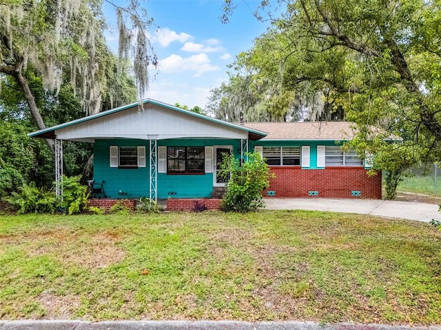 770 W Webster Ave, Winter Park, FL 32789 - view of front of property with a front lawn and concrete driveway