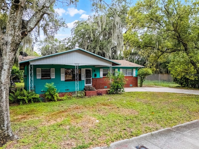 770 W Webster Ave, Winter Park, FL 32789 - view of front of house featuring driveway and a porch