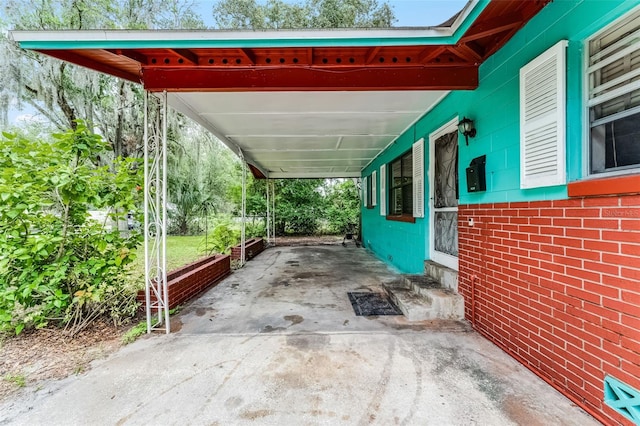 770 W Webster Ave, Winter Park, FL 32789 - view of car parking with an attached carport, concrete driveway, and entry steps