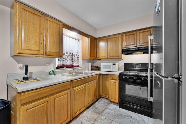 770 W Webster Ave, Winter Park, FL 32789 - kitchen featuring freestanding refrigerator, white microwave, black gas range, and light countertops