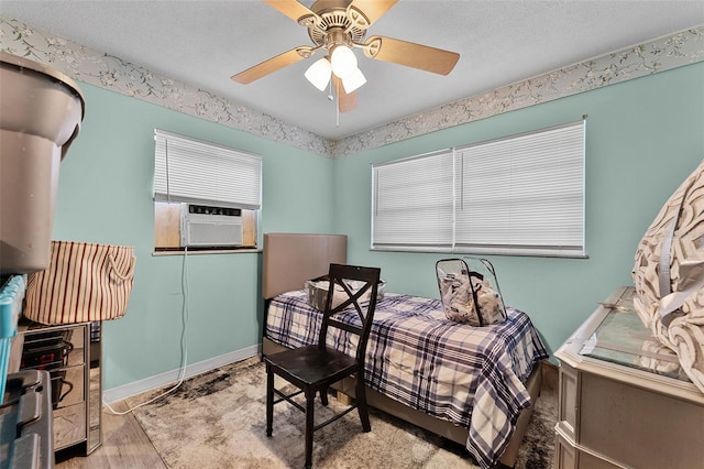 770 W Webster Ave, Winter Park, FL 32789 - bedroom featuring wood finished floors, cooling unit, ceiling fan, and a textured ceiling