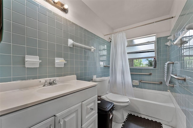 770 W Webster Ave, Winter Park, FL 32789 - full bathroom featuring shower / tub combo with curtain, vanity, tile walls, and tile patterned flooring