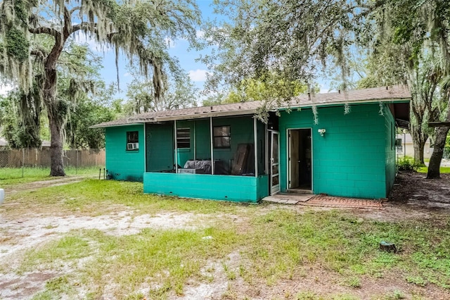 770 W Webster Ave, Winter Park, FL 32789 - back of property with a sunroom and concrete block siding