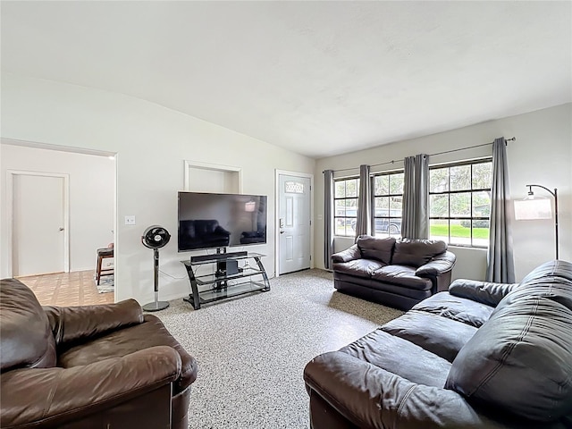 131 E 3rd Ct, Chuluota, FL 32766 - living room featuring vaulted ceiling and speckle patterned floor