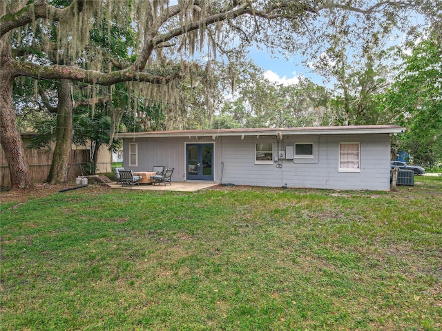 131 E 3rd Ct, Chuluota, FL 32766 - rear view of house with french doors and a patio