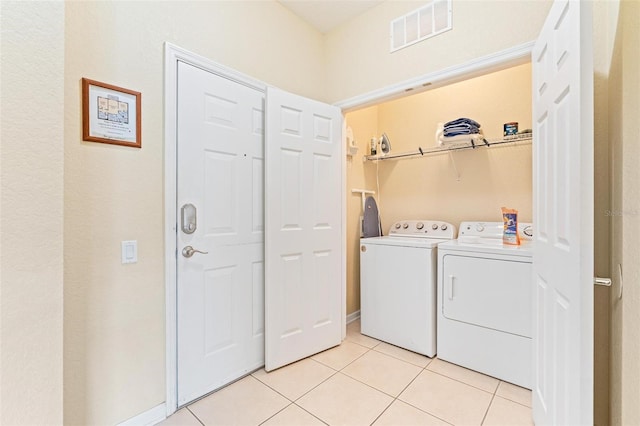 4024 Breakview Dr Unit 402, Orlando, FL 32819 - laundry area with separate washer and dryer and light tile patterned flooring