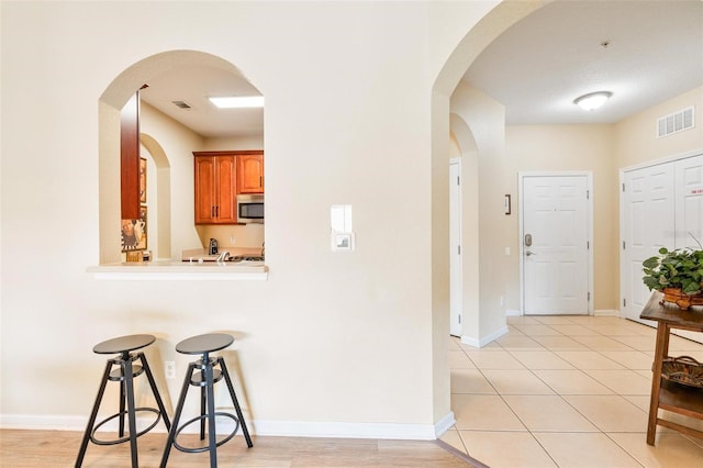 4024 Breakview Dr Unit 402, Orlando, FL 32819 - foyer entrance featuring baseboards and light tile patterned flooring