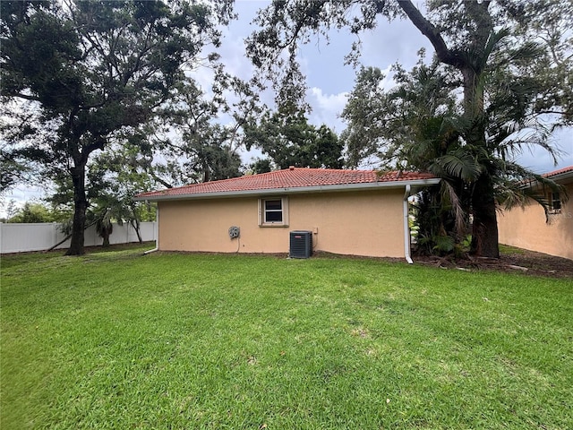 131 49th Ct E, Palmetto, FL 34221 - back of house with stucco siding and a tiled roof