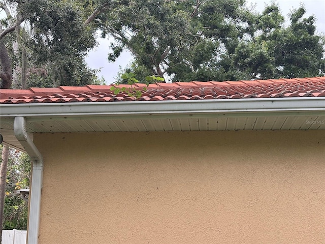 131 49th Ct E, Palmetto, FL 34221 - exterior view of stucco siding, a downspout, and gutters