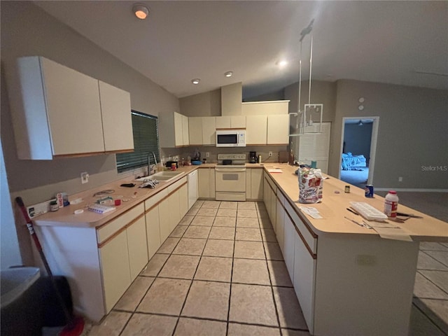 131 49th Ct E, Palmetto, FL 34221 - kitchen featuring white appliances, a peninsula, light countertops, vaulted ceiling, and light tile patterned floors
